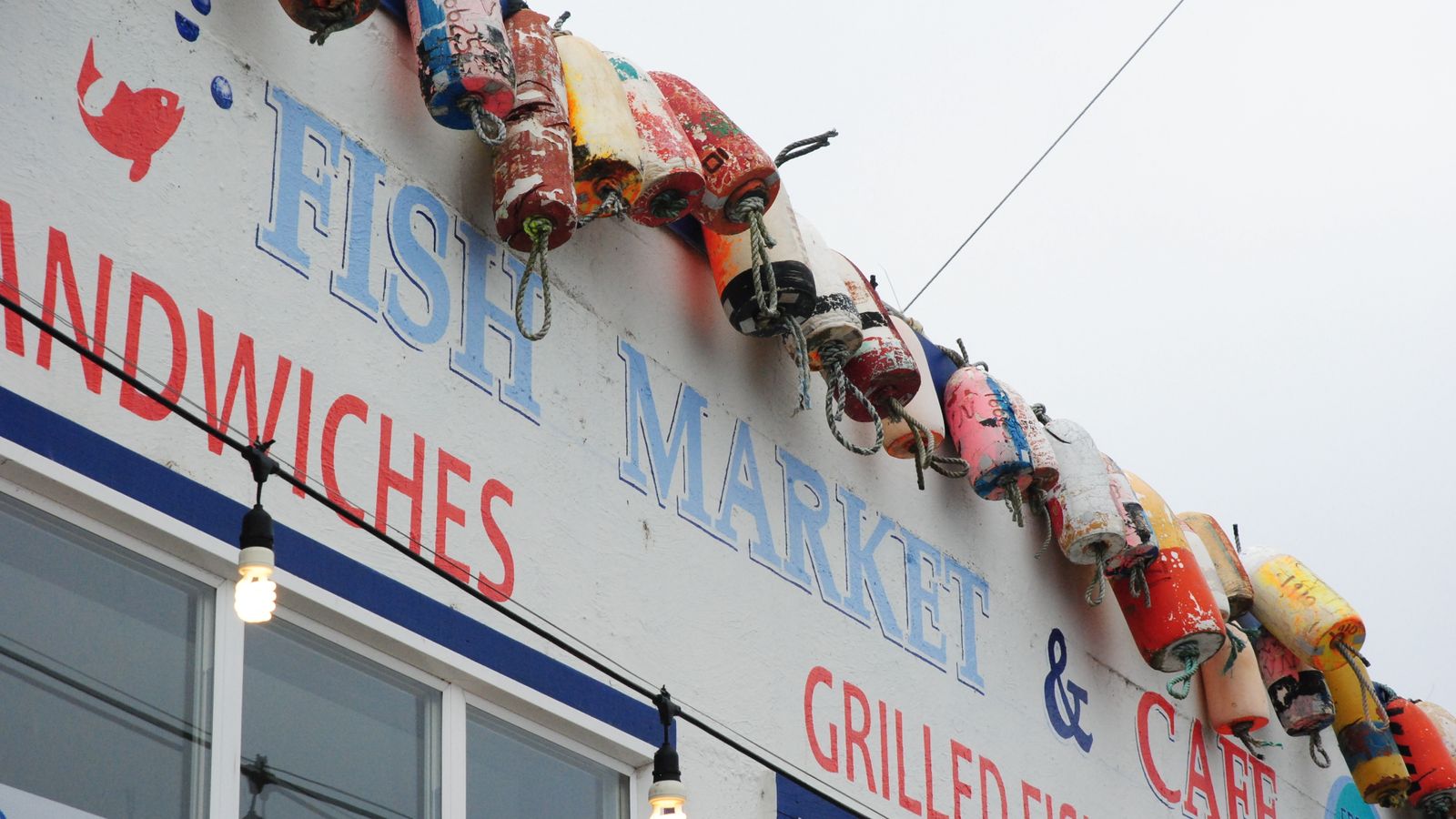 Fish market and sandwich shop with buoys on the roof