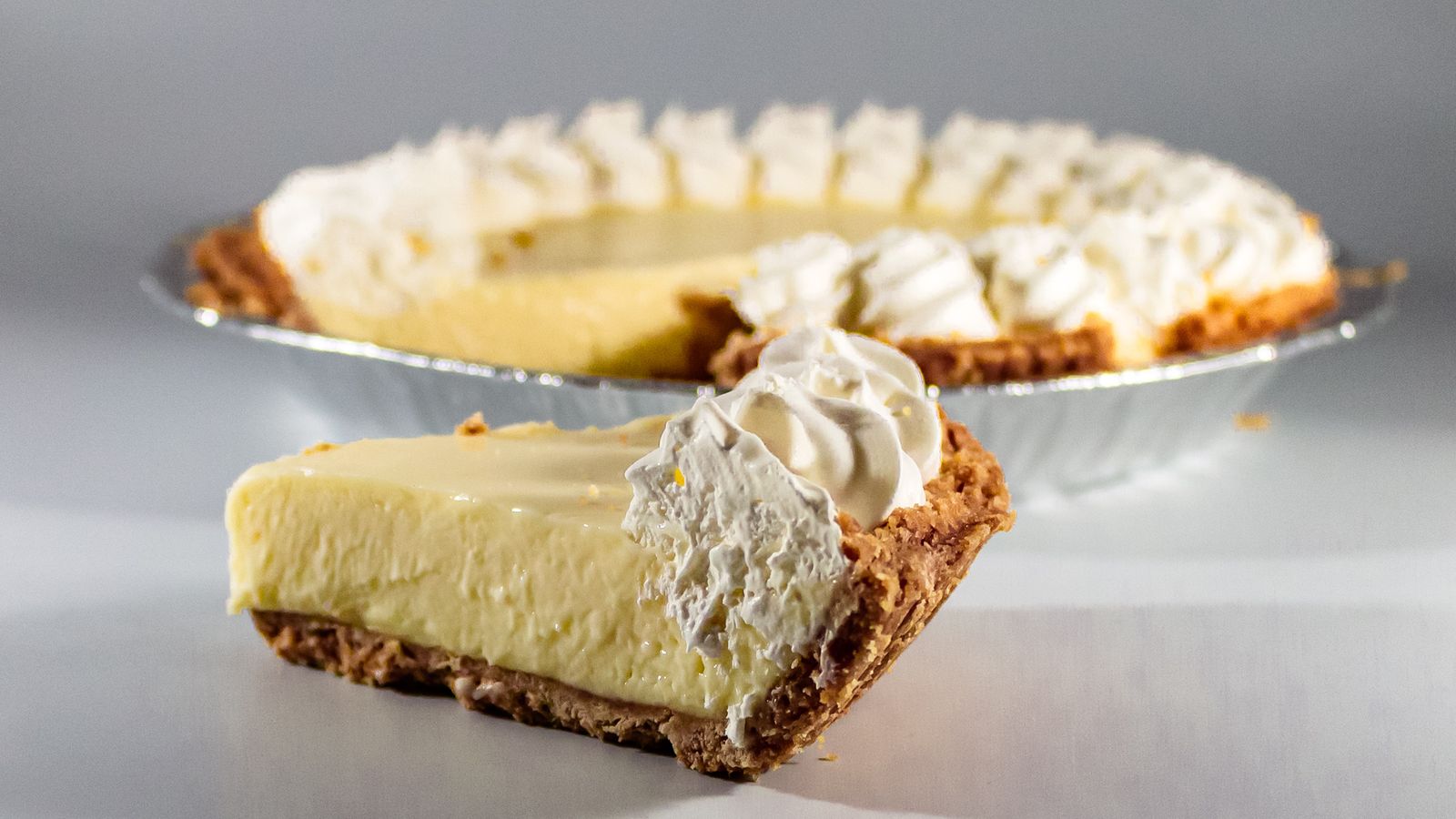 Slice of key lime pie with whipped cream
