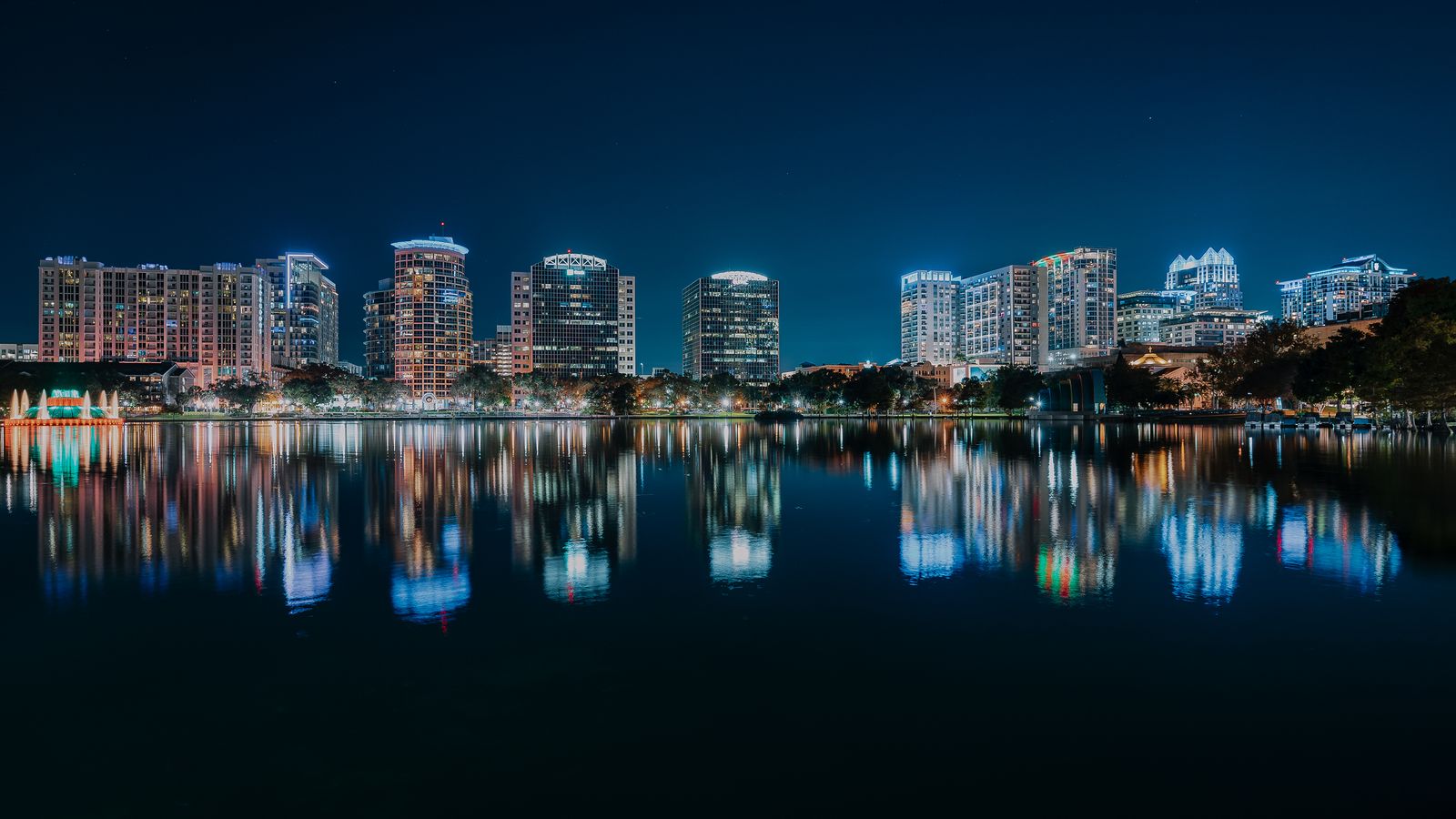 Central Florida city skyline reflected in a lake at night